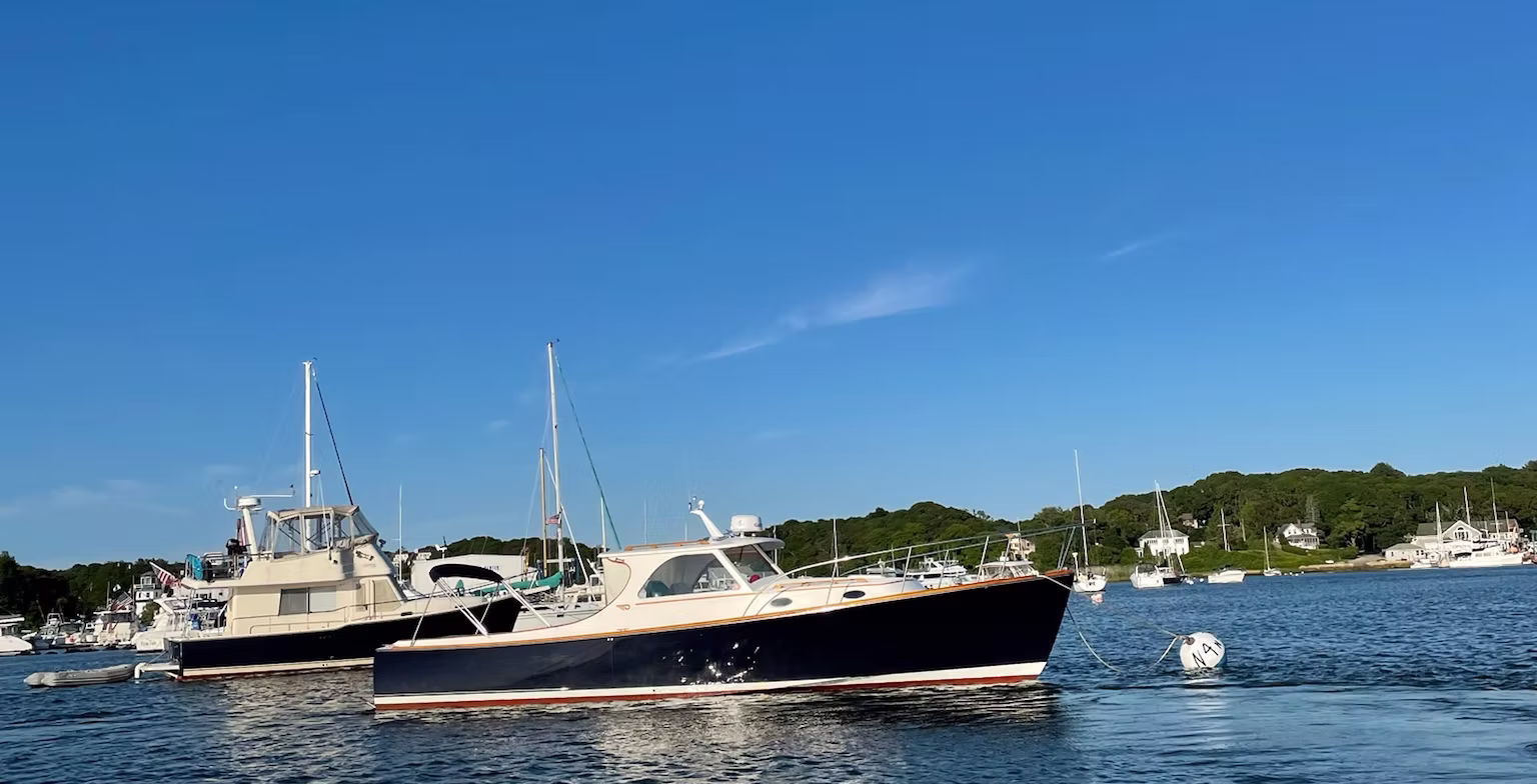 The charter boat moored on Buzzards Bay under a clear blue summer sky